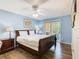 This bedroom boasts wood floors, ceiling fan, and outdoor patio access at 8704 Knightsbridge Ct # B, Kissimmee, FL 34747