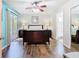 This primary bedroom has wood floors, ceiling fan, and a sliding door to the outdoor space at 8704 Knightsbridge Ct # B, Kissimmee, FL 34747