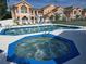 Inviting community pool and jacuzzi offer a refreshing escape, perfect for relaxation and socializing at 8704 Knightsbridge Ct # B, Kissimmee, FL 34747