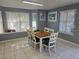 Well-lit dining room featuring tile floors and large windows with blinds at 8704 Knightsbridge Ct # B, Kissimmee, FL 34747