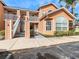 Inviting two-story condo with well-maintained landscaping, charming details, and ample parking at 8704 Knightsbridge Ct # B, Kissimmee, FL 34747