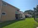 A two-story condominium with stairs and decks overlooking a grassy lawn at 8704 Knightsbridge Ct # B, Kissimmee, FL 34747