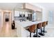 Kitchen featuring modern appliances, breakfast bar with seating, and tile backsplash at 8704 Knightsbridge Ct # B, Kissimmee, FL 34747
