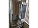 Modern stainless steel refrigerator with water dispenser and digital display, offering both style and functionality at 8704 Knightsbridge Ct # B, Kissimmee, FL 34747