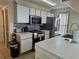 Bright kitchen with stainless steel appliances, modern cabinetry, and ample counter space at 8704 Knightsbridge Ct # B, Kissimmee, FL 34747