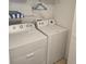 Functional laundry room with a side-by-side washer and dryer for added convenience at 8704 Knightsbridge Ct # B, Kissimmee, FL 34747