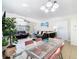 Open-concept living room and dining room with modern furnishings and plenty of natural light at 8704 Knightsbridge Ct # B, Kissimmee, FL 34747
