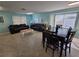 Spacious living room with tile flooring, furniture, and lots of natural light at 8704 Knightsbridge Ct # B, Kissimmee, FL 34747
