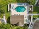 Overhead shot of the pool area featuring the inviting pool, hot tub, sun loungers and pristine green space at 8704 Knightsbridge Ct # B, Kissimmee, FL 34747