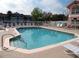 Relaxing community pool area with lounge chairs and clear blue water at 8704 Knightsbridge Ct # B, Kissimmee, FL 34747