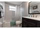 Clean bathroom features a shower and bath with a dark vanity at 8719 Rockingham Ter # B, Kissimmee, FL 34747
