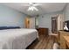 Comfortable bedroom featuring wood floors and plenty of light at 8719 Rockingham Ter # B, Kissimmee, FL 34747