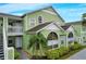 Charming condo building with light green exterior and white trim at 8719 Rockingham Ter # B, Kissimmee, FL 34747