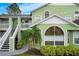 Charming condo building with light green exterior and white trim at 8719 Rockingham Ter # B, Kissimmee, FL 34747