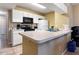 Functional kitchen with white cabinetry and essential appliances at 8719 Rockingham Ter # B, Kissimmee, FL 34747