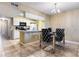 Open-concept kitchen with modern appliances next to a dining area at 8719 Rockingham Ter # B, Kissimmee, FL 34747