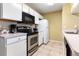 Functional kitchen with white cabinetry and essential appliances at 8719 Rockingham Ter # B, Kissimmee, FL 34747