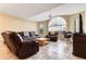 Bright living room featuring tile flooring and large windows at 8719 Rockingham Ter # B, Kissimmee, FL 34747