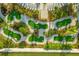 Aerial view of community putt putt golf course surrounded by lush landscaping at 8811 Bally Neal Loop, Davenport, FL 33896