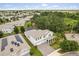 Aerial view of the backyard of a two-story home with solar panels on the adjacent house at 8811 Bally Neal Loop, Davenport, FL 33896