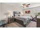 Cozy bedroom featuring a large bed, exercise bike, and bedside tables at 8811 Bally Neal Loop, Davenport, FL 33896