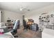 Spacious bedroom showing multiple desk areas and crafting equipment at 8811 Bally Neal Loop, Davenport, FL 33896