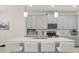 Bright kitchen featuring a large island, stainless steel appliances, and ample cabinet space at 8811 Bally Neal Loop, Davenport, FL 33896