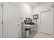 Functional office nook with desk and shelving between two doors at 8811 Bally Neal Loop, Davenport, FL 33896