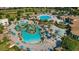 Stunning aerial view of the community pool with lush landscaping at 8811 Bally Neal Loop, Davenport, FL 33896