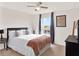Relaxing bedroom boasts natural light, neutral colors, and inviting ambiance at 987 Nathan Ridge Rd, Clermont, FL 34715