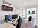 Hallway with desk, monitors and baseball decor at 987 Nathan Ridge Rd, Clermont, FL 34715