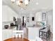 Well-designed kitchen with stainless steel appliances, granite counters, and breakfast bar flowing into the dining area at 987 Nathan Ridge Rd, Clermont, FL 34715
