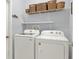 Functional laundry room equipped with modern washer and dryer units at 987 Nathan Ridge Rd, Clermont, FL 34715