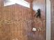 Close-up of the tiled shower with a rainfall shower head and niche shelf detail at 987 Nathan Ridge Rd, Clermont, FL 34715