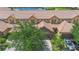 An aerial view displays the property's prime location near a serene pond and well-maintained community grounds at 10430 Belfry Cir, Orlando, FL 32832