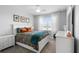 Bedroom featuring neutral walls, carpet, a large window, and furniture, with a view of the lake at 10430 Belfry Cir, Orlando, FL 32832