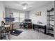 Bedroom with carpet, a work station, and desk, as well as an art studio with natural light at 10430 Belfry Cir, Orlando, FL 32832