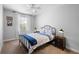 Bedroom featuring neutral walls, carpet, a large window, furniture, and is decorated in blue tones at 10430 Belfry Cir, Orlando, FL 32832