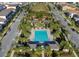 Aerial view of the community pool featuring a meticulously designed layout with covered areas and lounge seating at 10430 Belfry Cir, Orlando, FL 32832