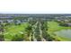 Picturesque aerial view of the lush golf course winding through the community at 10430 Belfry Cir, Orlando, FL 32832