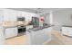 Modern kitchen featuring stainless appliances, white cabinets, granite countertops, and tile flooring at 10430 Belfry Cir, Orlando, FL 32832