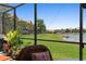 Enjoy serene water views from the screened patio with lush landscaping in this beautiful home at 10430 Belfry Cir, Orlando, FL 32832