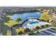 Aerial view of the community pool featuring a spa and manicured landscaping in a tranquil setting at 10430 Belfry Cir, Orlando, FL 32832