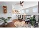 Upstairs sitting area with hardwood floors, natural light, decor, and comfortable chairs with footrests at 10430 Belfry Cir, Orlando, FL 32832
