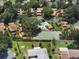 Aerial view of the community showcasing a pool and tennis courts at 105 Oaks Ct, Sanford, FL 32771