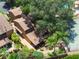 Aerial view of the property showcasing a lush backyard and tennis court at 105 Oaks Ct, Sanford, FL 32771
