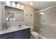 Bathroom featuring large mirror, vanity, toilet, and walk-in shower at 105 Oaks Ct, Sanford, FL 32771