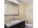Bathroom featuring granite vanity, updated fixtures, and white toilet at 105 Oaks Ct, Sanford, FL 32771