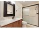 Updated bathroom with wood vanity, marble countertop and a glass shower at 105 Oaks Ct, Sanford, FL 32771