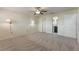 Spacious bedroom featuring a ceiling fan, and ensuite bathroom at 105 Oaks Ct, Sanford, FL 32771